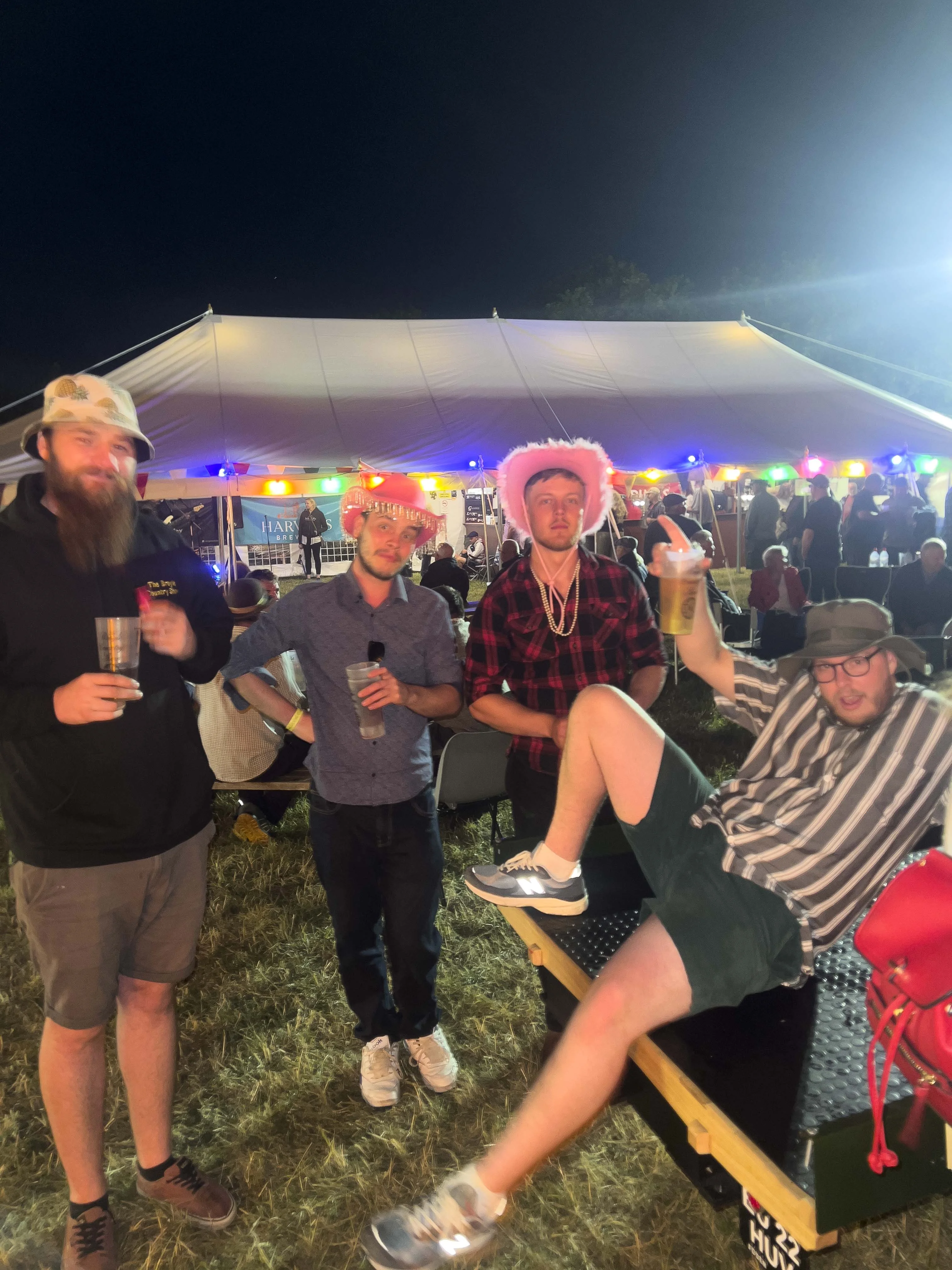 Jordan, Korben, Blue and Toby enjoying drinks near the beer tent
