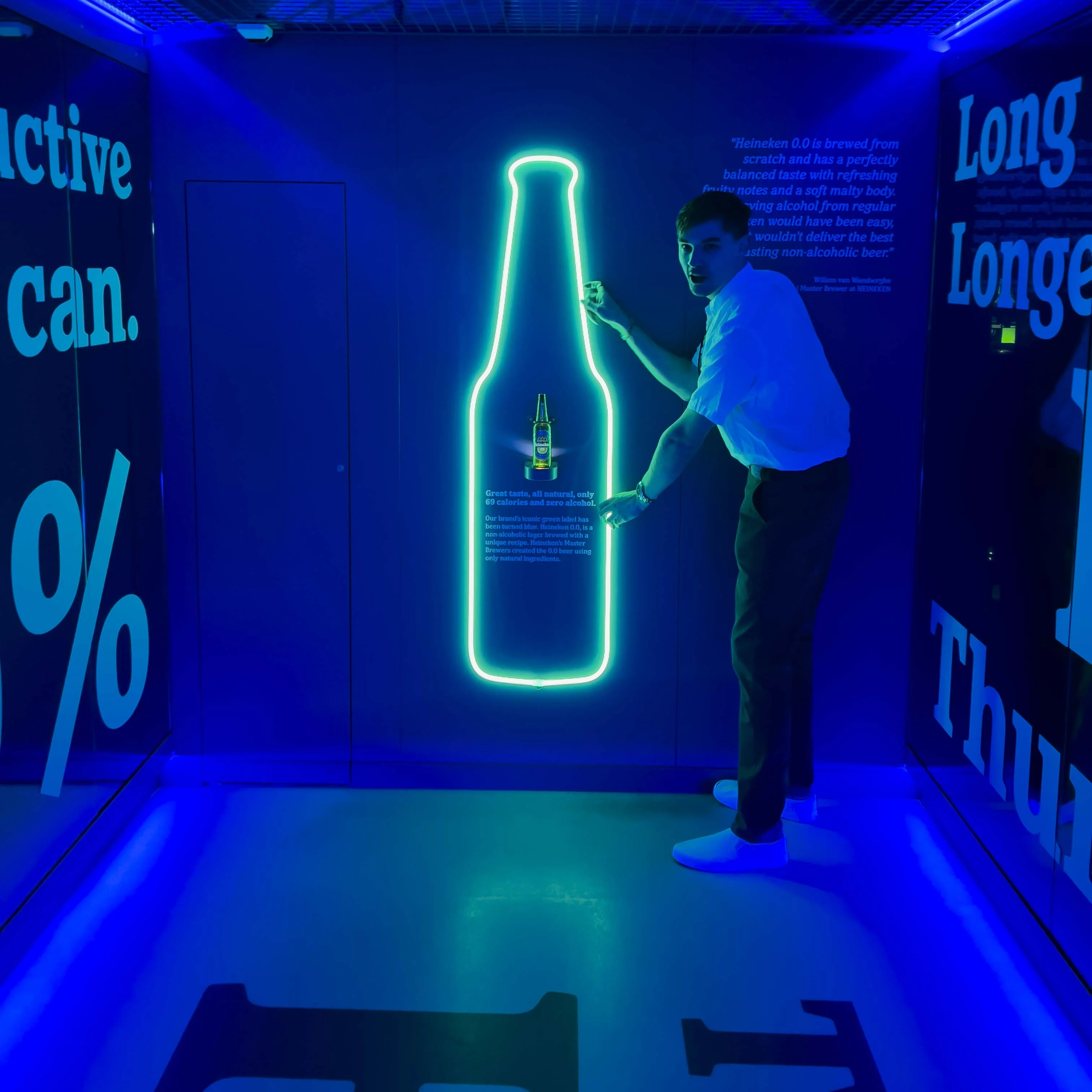 Ryan holding a large Heineken light